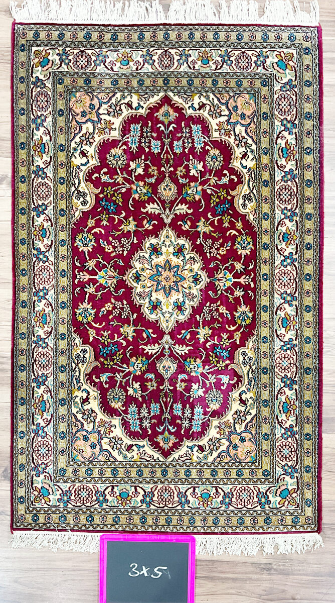 Hand-knotted silk on cotton rug — rich red medallion design